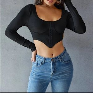 Asymmetrical hook hem top